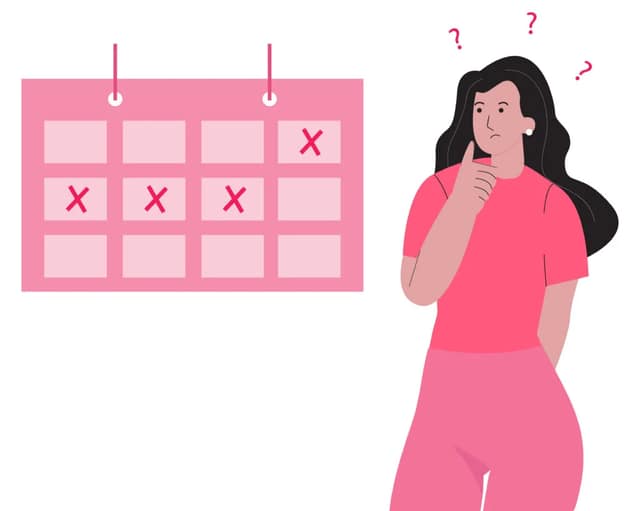 calcul ovulation illustré par une femme devant un calendrier de cycle menstruel