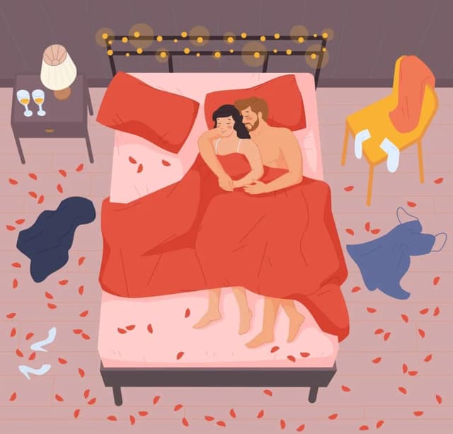 Positions pour tomber enceinte couple allongé dans un lit romantique